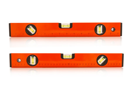 Yellow building level or water level meter with a ruler isolated on white background
