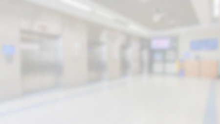 Abstract blurred background of hospital's hallway and elevator, moving emergency for patients...