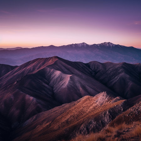 A photograph of majestic purple mountains at sunset, featuring the beauty and grandeur of the natural world.の素材