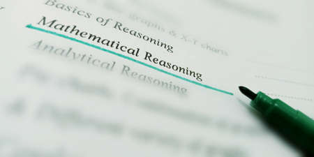 Reasoning mathematical terminology presented on book text highlighted pattern on educational...