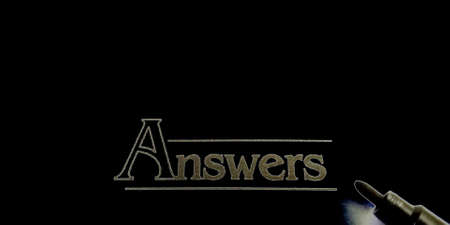 Answer word educational text displayed on paper in english language on book format black background.の写真素材
