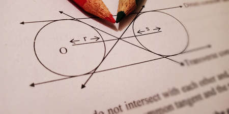 Circle with pencil pointer maths educational text displayed on paper in english language on numerical format background.の写真素材