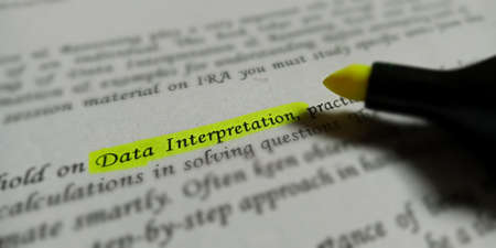 Data interpretation mathematical terminology presented on book text highlighted pattern on...