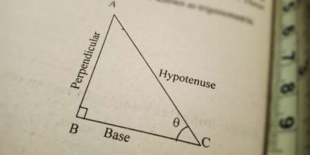 trigonometry perpendicular and hypotenuse maths educational text displayed on paper in english...