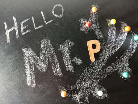 Hello mister P text displayed on chalk board concept with wooden alphabet english symbol.の写真素材