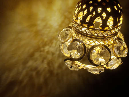 Golden night lamp background with diamond light reflecting patten texture.の写真素材