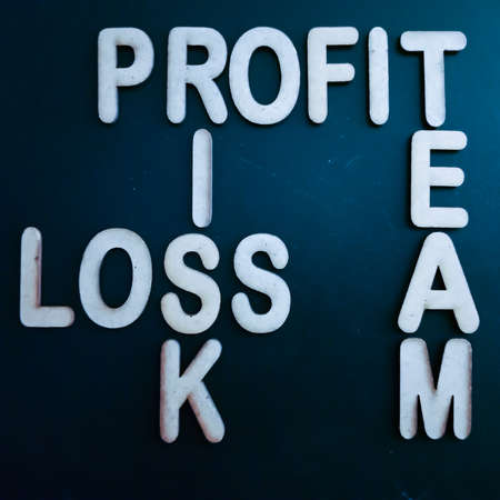 Profit team risk loss business word presented with cross text art black 3d pattern for learning purpose.の写真素材