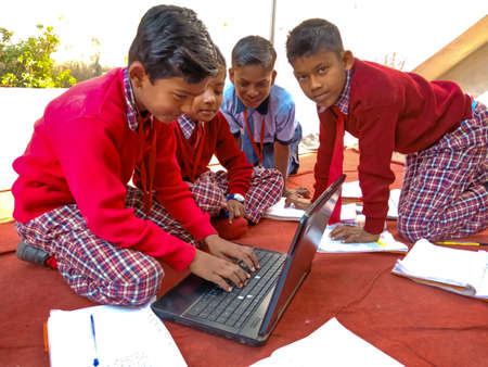 DISTRICT KATNI, INDIA - JANUARY 13, 2020: Indian primary school student groups learning together...