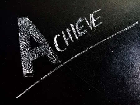 Achieve word displayed on chalkboard for learning and awareness terminology for education purpose.の写真素材