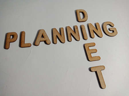 Diet Planning word display with cross wooden alphabet concept for informational awareness.の写真素材