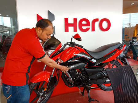 DISTRICT KATNI, INDIA - JANUARY 29, 2020: an indian Automobile sales worker presenting latest Hero...