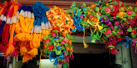 DISTRICT KATNI, INDIA - AUGUST 12, 2019: Beautiful colorful artificial flower garland displayed for...
