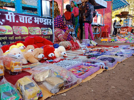 DISTRICT KATNI, INDIA - FEBRUARY 02, 2020: Kids toy displayed at street poor market during hindu traditional festival summer season.のeditorial素材