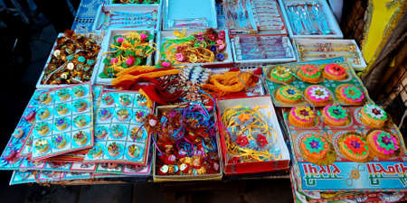 DISTRICT KATNI, INDIA - AUGUST 12, 2019: Traditional colorful Rakhi displayed for sale demonstration during Raksha Bandhan hindu religious festival at rural market.のeditorial素材
