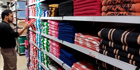 DISTRICT KATNI, INDIA - SEPTEMBER 16, 2019: Branded Towels presented at racks for selling product at mega mart store.のeditorial素材
