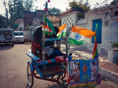 DISTRICT KATNI, INDIA - OCTOBER 06, 2019: an indian rickshaw rider sleeping for rest on road.