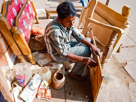 DISTRICT KATNI, INDIA - JANUARY 08, 2020: An indian woodworker working on workshop.のeditorial素材