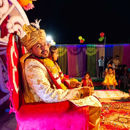 DISTRICT KATNI, INDIA - MAY 23, 2020: Indian groom looking at camera at marriage function during asian traditional wedding events.のeditorial素材
