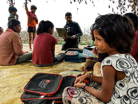 DISTRICT KATNI, INDIA - JANUARY 01, 2020: Indian government school poor children studying together...