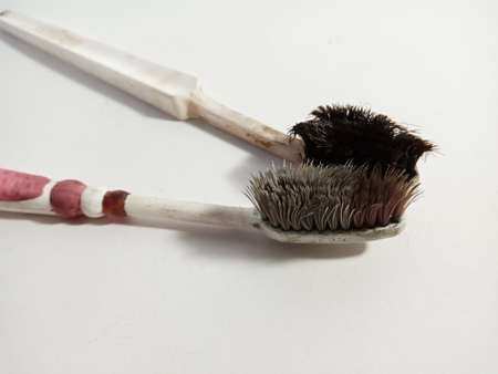 Double used tooth brush isolated on white background for marketing and branding promotional purpose...
