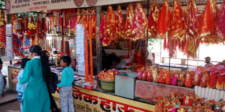 DISTRICT KATNI, INDIA - OCTOBER 13, 2019: Hindu religious product displayed at hindu temple street store in village area.のeditorial素材