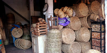 DISTRICT KATNI, INDIA - OCTOBER 13, 2019: Wooden made baskets presented on craft goods store at street village market.のeditorial素材