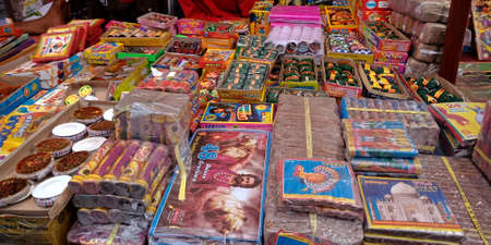 DISTRICT KATNI, INDIA - OCTOBER 15, 2019: Colorful Crackers and Sparkler displayed by asian vender for selling during hindu tradition Diwali festival at indian street city bazaar.のeditorial素材