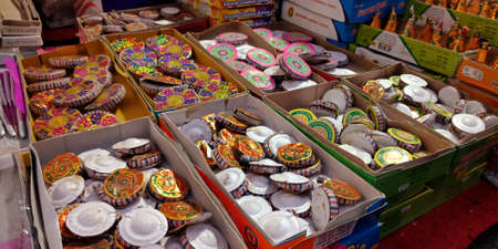 DISTRICT KATNI, INDIA - OCTOBER 15, 2019: Colorful Crackers called Chakri in hindi displayed by asian vender for selling during hindu tradition Diwali festival at indian street city bazaar.のeditorial素材
