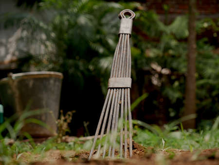 Sand collector tools isolate in natural green field background