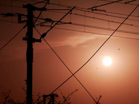 Electricity wiring pole during evening sunset time beautiful frame imageの写真素材