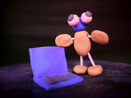 Cartoon clay man stand with laptop on blueish background
