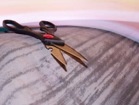 Scissor kept on mat with background light effect.の写真素材