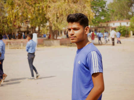 An indian boy standing alone at school ground background at day time at city Katni Madhya Pradesh in...