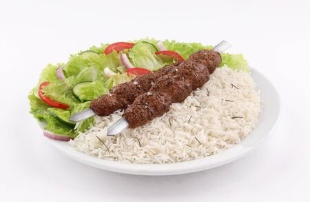 white dish  two Skewer shish kebab meat  with white rice and salad isolated on white backgroundの写真素材