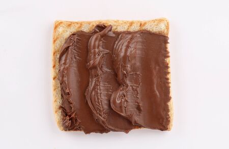 Delicious chocolate on French toast bread toasted on grill top view isolated on white backgroundの写真素材