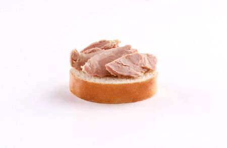 tuna on french bread, canape, spanish tapas isolated on white backgroundの写真素材