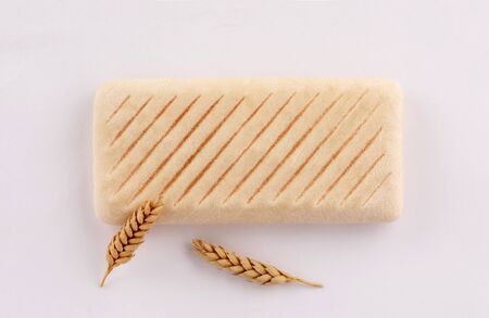 panini bread toasted with ears wheat top view on white background