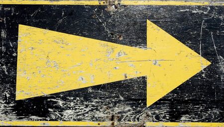 Arrow painted on woodの写真素材