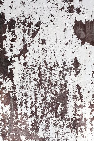 Old white flaking paint on a wooden surface.