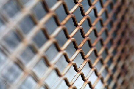 Rusty metallic net. Short depth-of-field.
