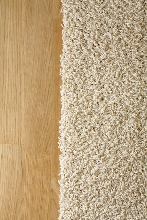 Rug on hardwood oak parquet floor