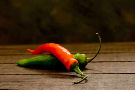 Chili Peppers on a wooden surface