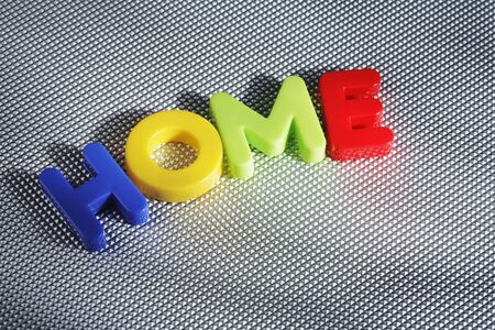 The word HOME spelled with plastic lettersの写真素材
