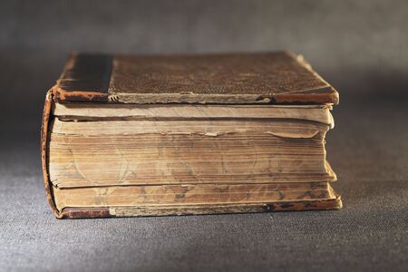 Old worn and yellowed bookの写真素材