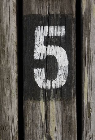 Number five painted on woodの写真素材