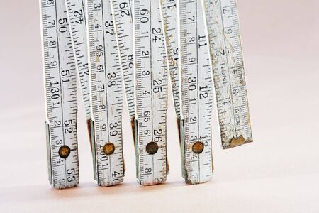 Old worn folding carpenter's ruler in closeupの写真素材