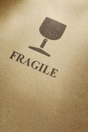 Fragile symbol printed on a cardboard boxの写真素材