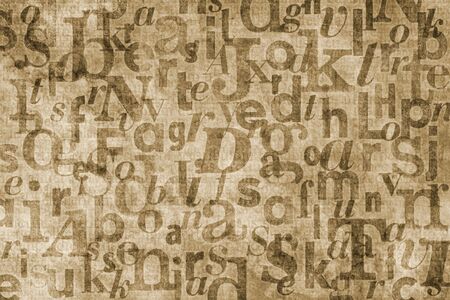 Grainy and gritty background image made of letters from old newspapers superimposed on eachother.の写真素材