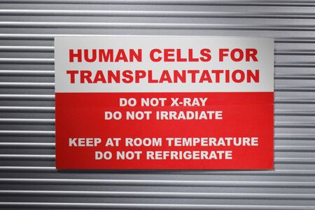 Human Cells for Transplantation information sticker. Short depth-of-field.