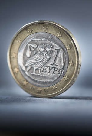 A worn and dirty Greek Euro coin. Short depth of field.の写真素材